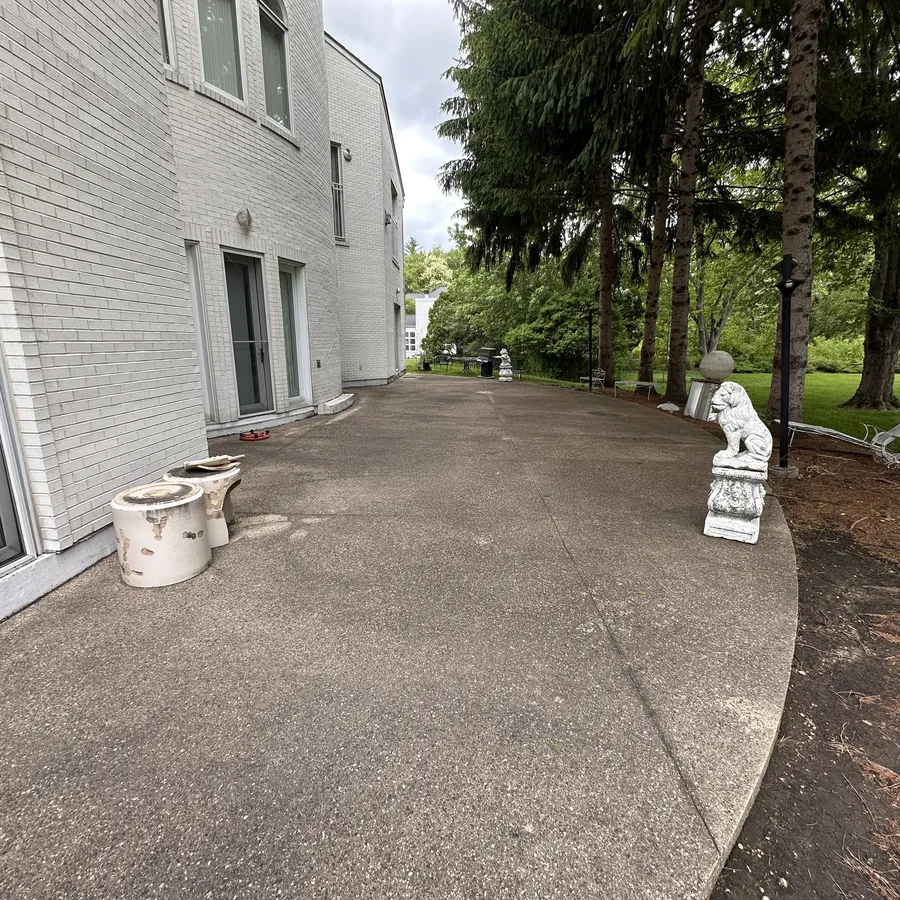Pressure washing before, stained concrete