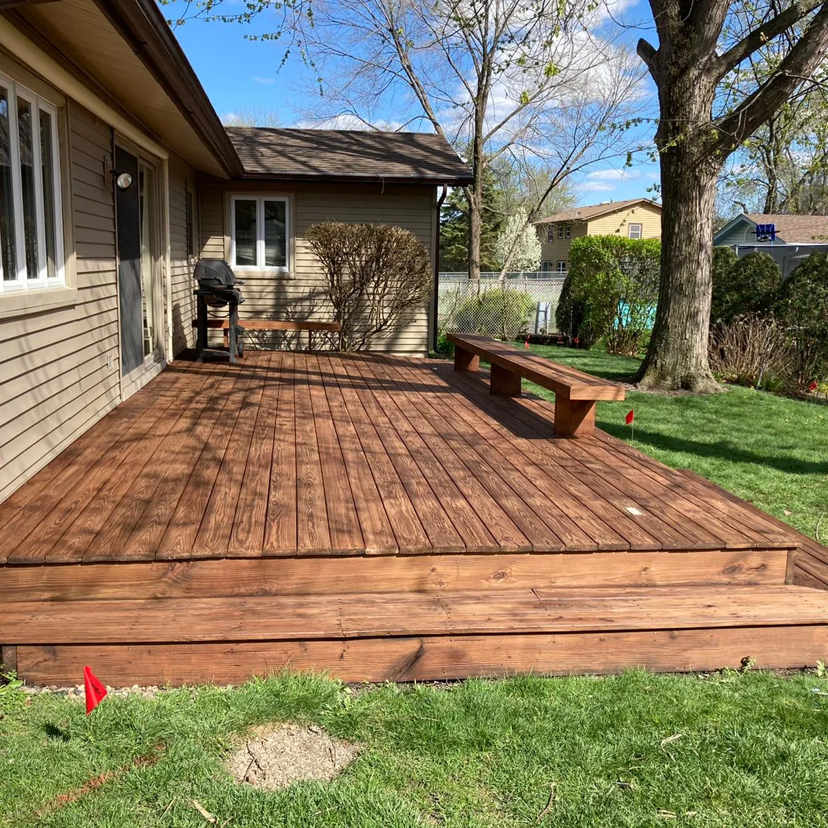 Deck staining before and after — weathered gray deck on top, restored and cleaned deck on bottom