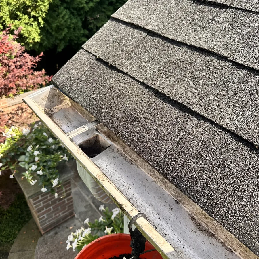The same gutter run cleared after cleaning