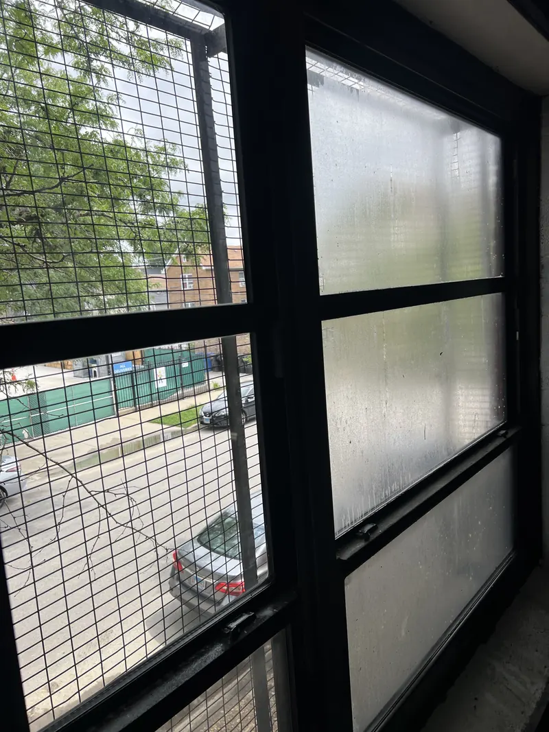 Cleaning a divided commercial window, spotted panes turning clear